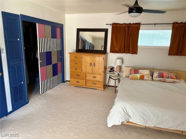 bedroom featuring a ceiling fan and light colored carpet