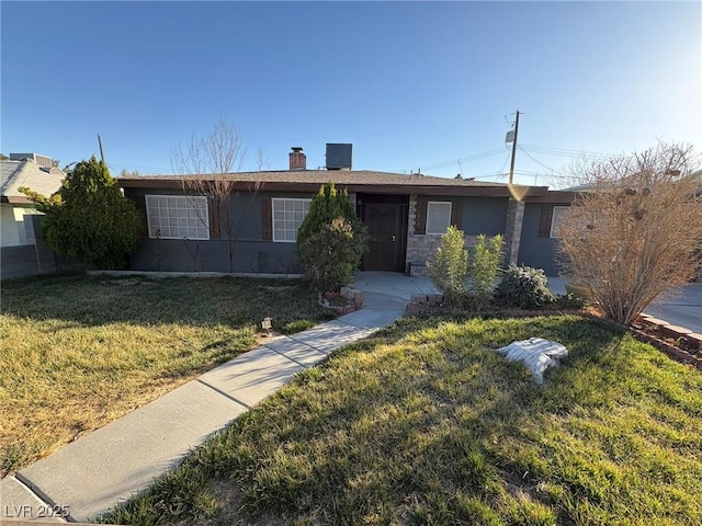 single story home with a front yard, stone siding, and stucco siding