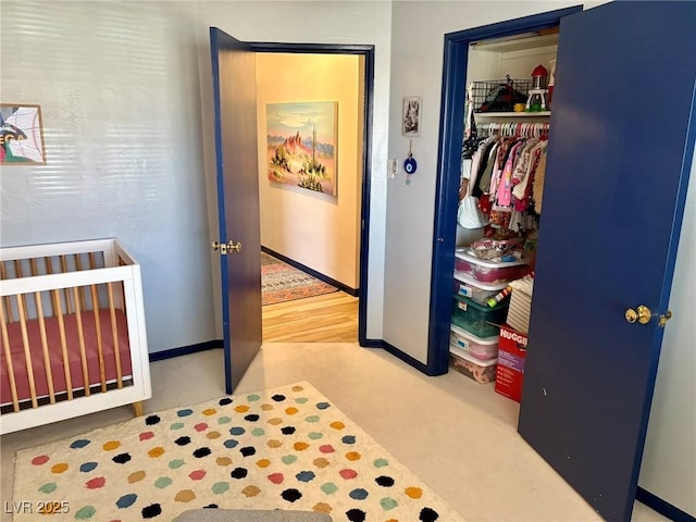 bedroom featuring a closet and baseboards