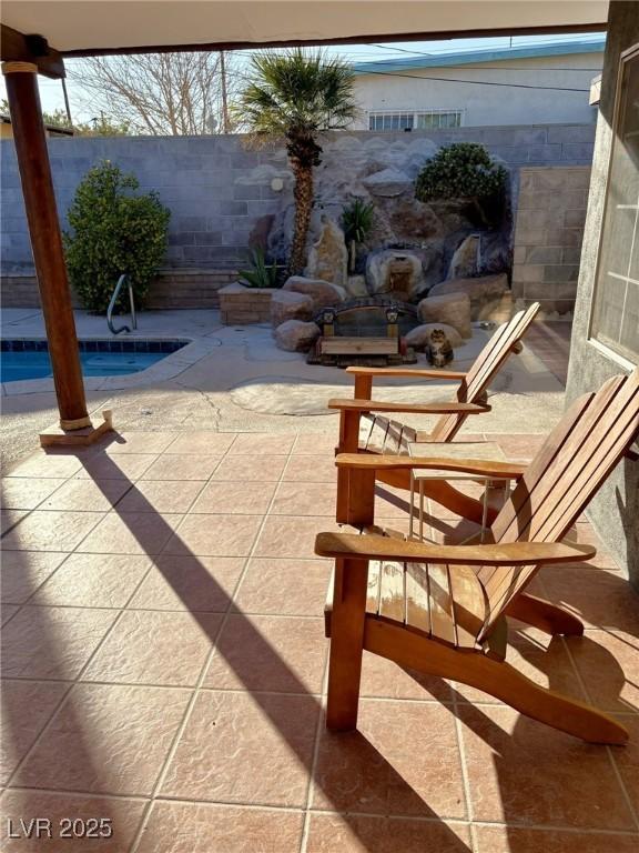 view of patio featuring fence