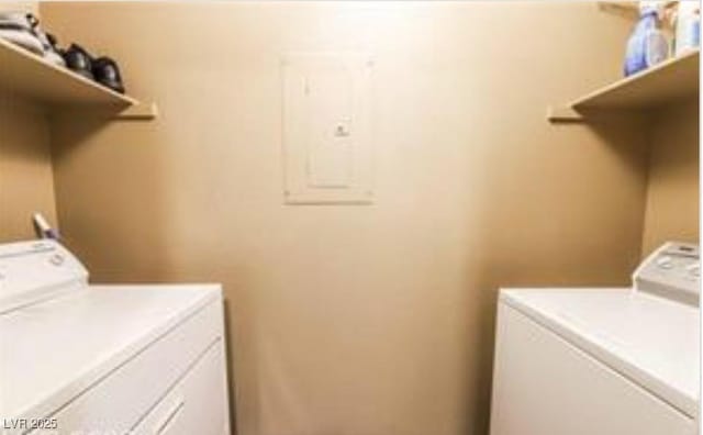 laundry room featuring washer and clothes dryer and electric panel