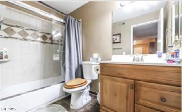 full bathroom featuring shower / bath combo, vanity, and toilet