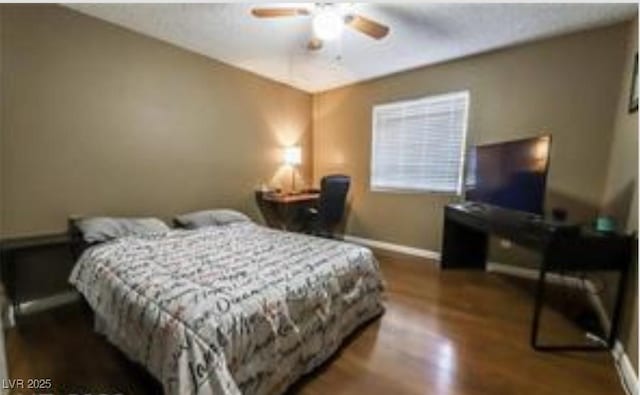 bedroom with wood-type flooring and ceiling fan