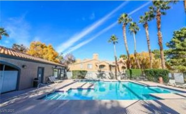 view of swimming pool featuring a patio area