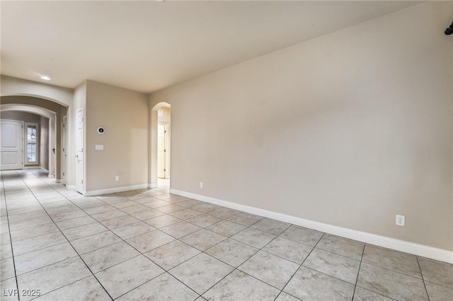 empty room featuring light tile patterned floors