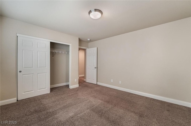 unfurnished bedroom with a closet and carpet flooring