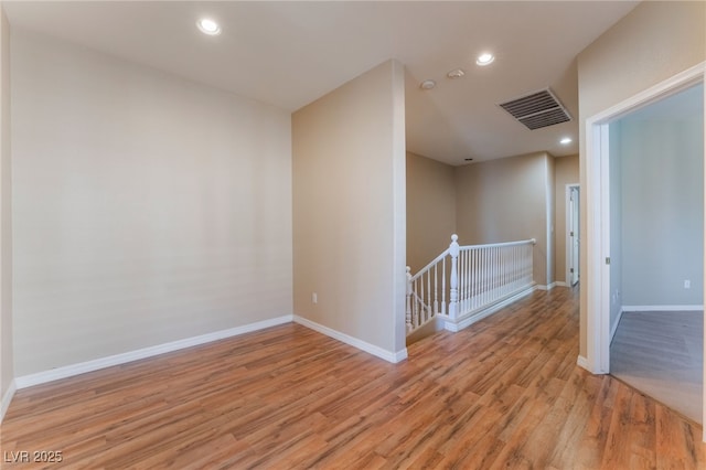 spare room featuring light hardwood / wood-style flooring