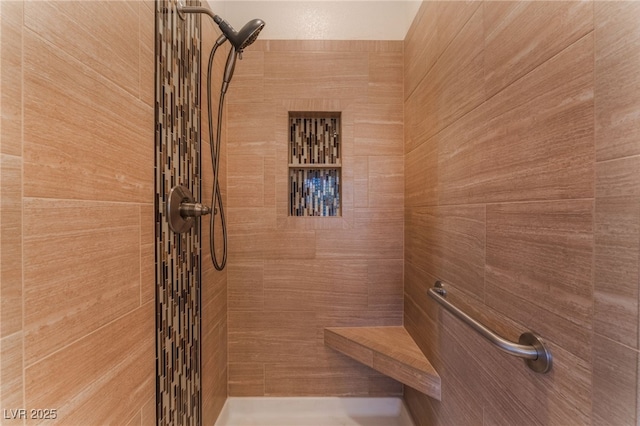 bathroom featuring tiled shower