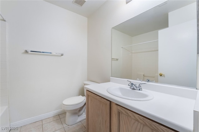 bathroom featuring vanity, tile patterned floors, and toilet