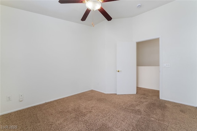 carpeted empty room featuring ceiling fan