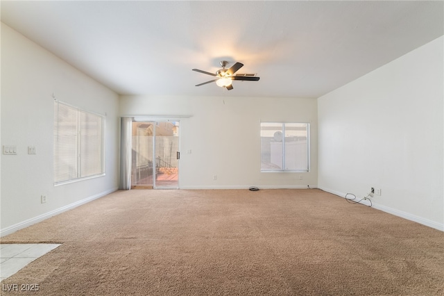 unfurnished room featuring light carpet and ceiling fan