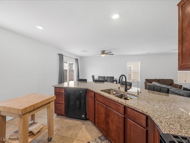 kitchen featuring sink, light tile patterned floors, ceiling fan, black dishwasher, and light stone counters