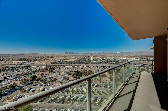 balcony featuring a view of city and a mountain view