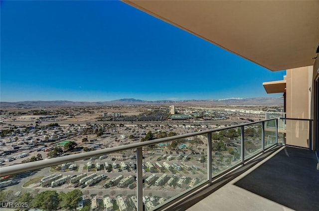 balcony with a view of city and a mountain view