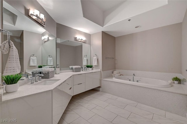 full bathroom featuring a garden tub and vanity