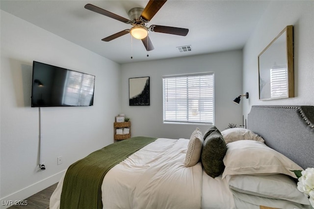 bedroom with ceiling fan and hardwood / wood-style floors