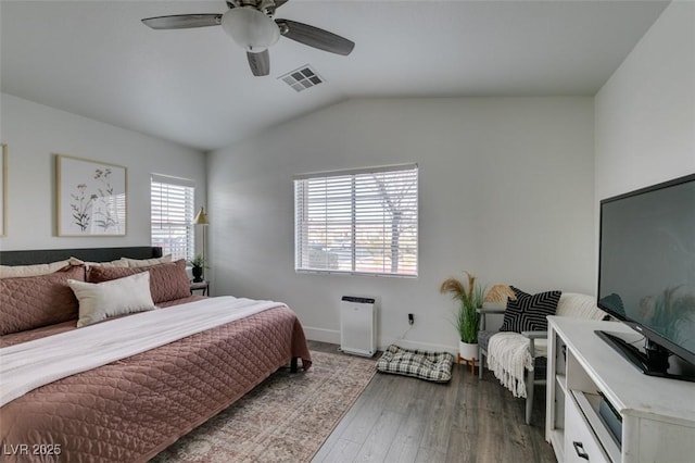 bedroom featuring ceiling fan, lofted ceiling, and dark hardwood / wood-style floors