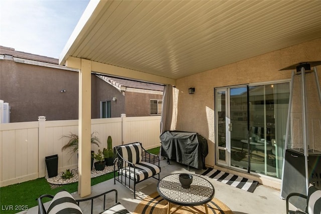 view of patio featuring a grill