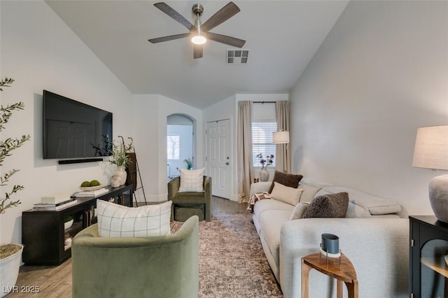 living room featuring lofted ceiling, hardwood / wood-style flooring, and ceiling fan