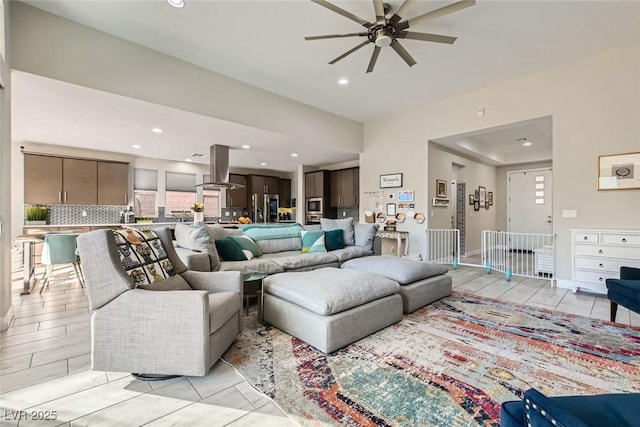 living room with ceiling fan and light tile patterned floors