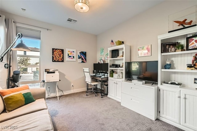 office area featuring light carpet