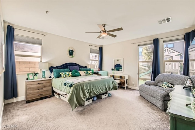 carpeted bedroom featuring ceiling fan