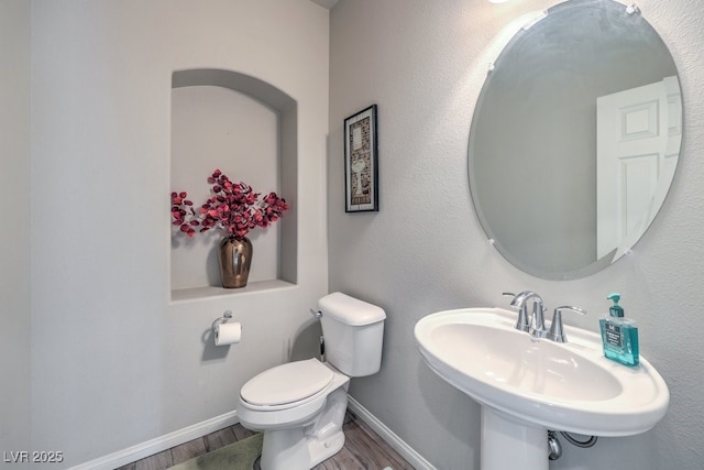 6461 Mount Eden Ave, Las Vegas, NV 89139 - bathroom with toilet, wood finished floors, baseboards, and a sink
