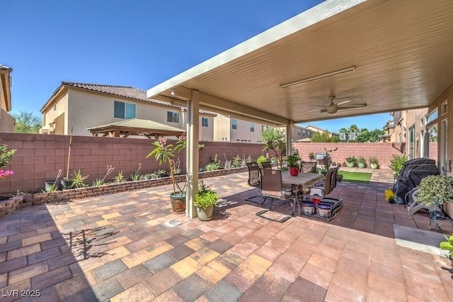 6461 Mount Eden Ave, Las Vegas, NV 89139 - view of patio featuring a fenced backyard, ceiling fan, and outdoor dining space