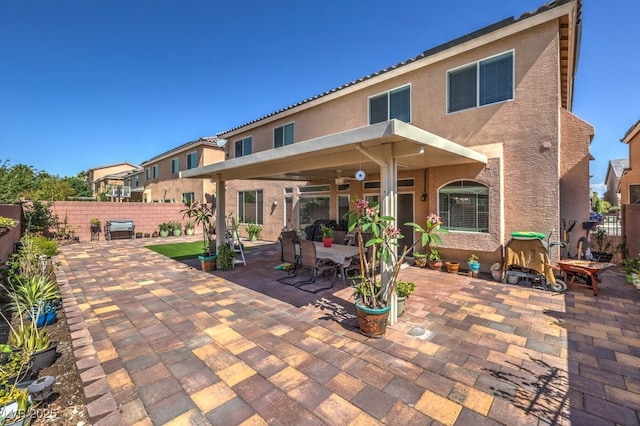 6461 Mount Eden Ave, Las Vegas, NV 89139 - rear view of property featuring a patio area, stucco siding, and a fenced backyard