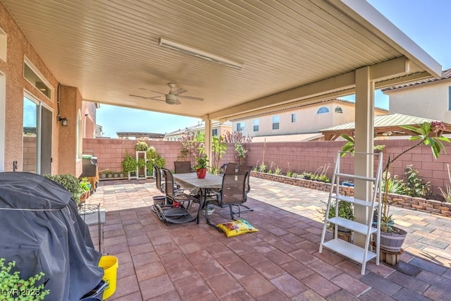 6461 Mount Eden Ave, Las Vegas, NV 89139 - view of patio with a fenced backyard, grilling area, ceiling fan, and outdoor dining space
