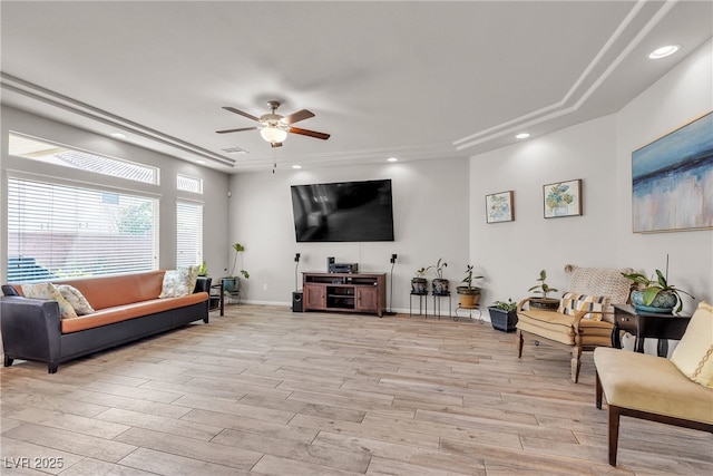 6461 Mount Eden Ave, Las Vegas, NV 89139 - living room with a ceiling fan, a raised ceiling, light wood-style flooring, and recessed lighting