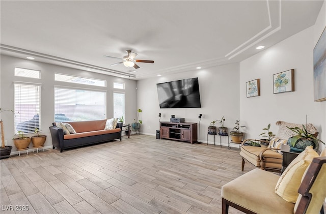 6461 Mount Eden Ave, Las Vegas, NV 89139 - living area with a ceiling fan, a raised ceiling, light wood-style flooring, and recessed lighting