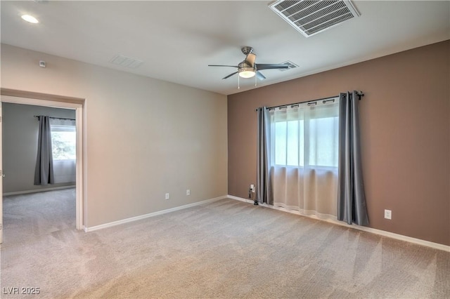 carpeted empty room featuring recessed lighting, visible vents, ceiling fan, and baseboards