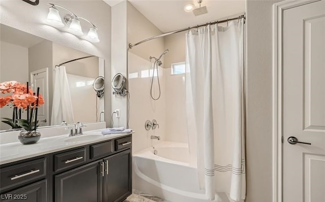 bathroom featuring shower / tub combo with curtain and vanity