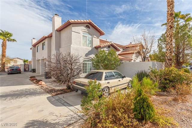 view of property exterior with a garage