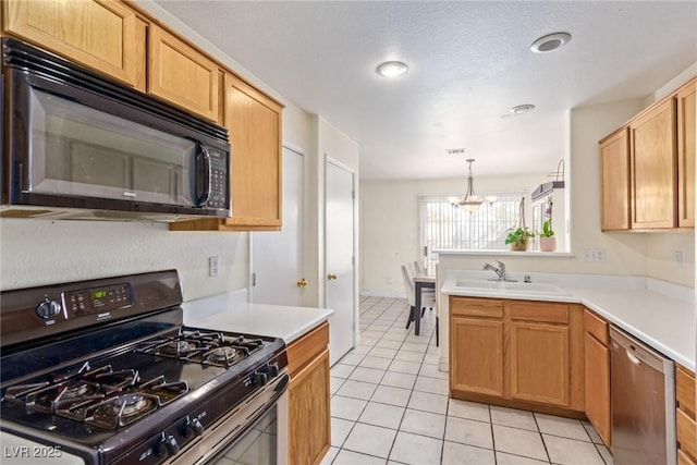 kitchen featuring sink, light tile patterned floors, a notable chandelier, pendant lighting, and black appliances