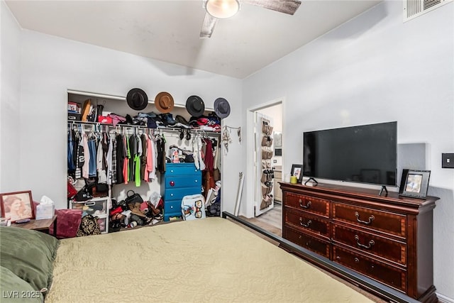 bedroom featuring ceiling fan and a closet