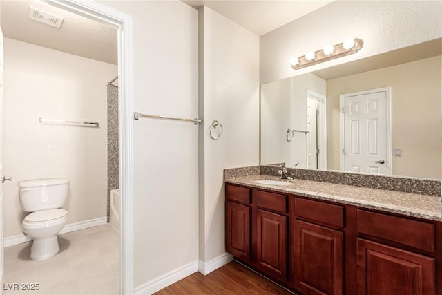 full bathroom with vanity, shower / bathing tub combination, and toilet