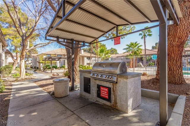 view of patio featuring area for grilling and exterior kitchen