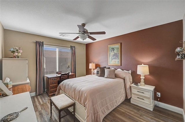 bedroom featuring dark hardwood / wood-style floors and ceiling fan