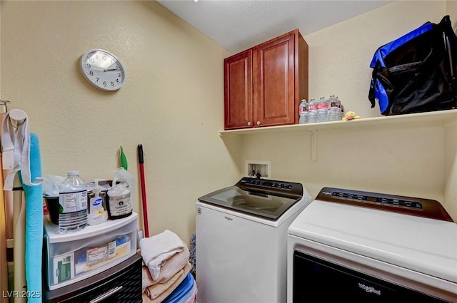 laundry room featuring cabinets and independent washer and dryer