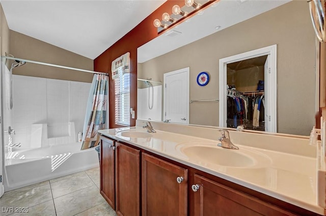 bathroom featuring vaulted ceiling, vanity, tile patterned flooring, and shower / bath combo with shower curtain