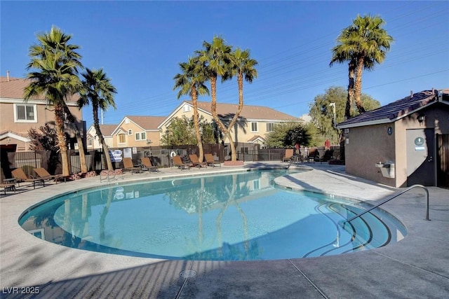 view of swimming pool with a patio area