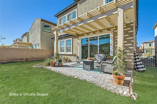 rear view of house featuring a lawn, a patio area, and a pergola