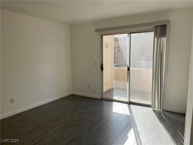 empty room with dark wood-type flooring