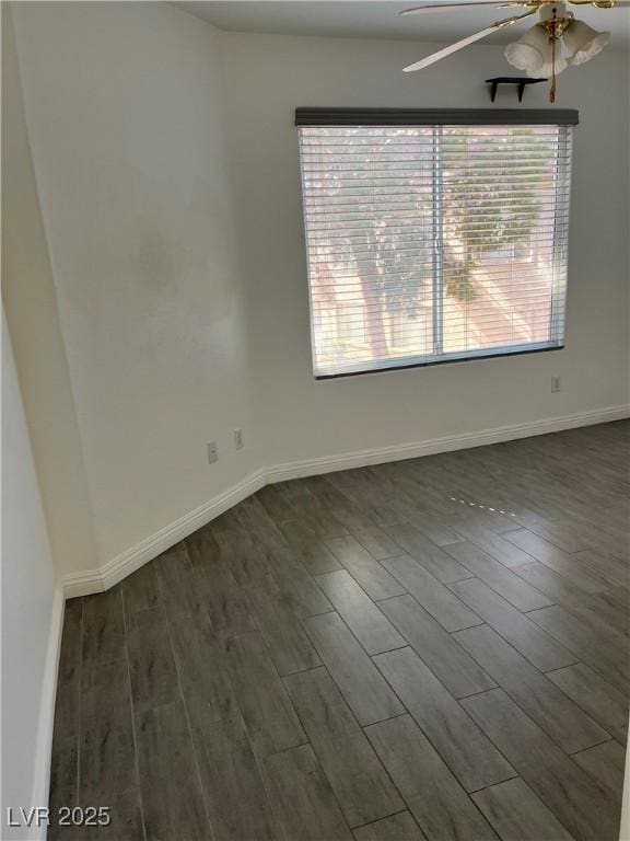 unfurnished room with dark wood-type flooring, plenty of natural light, and ceiling fan