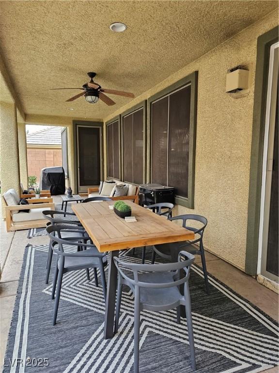 view of patio / terrace featuring ceiling fan