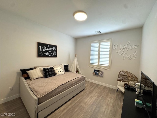 bedroom featuring hardwood / wood-style floors