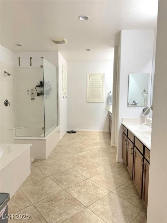 bathroom featuring vanity, tile patterned floors, and separate shower and tub