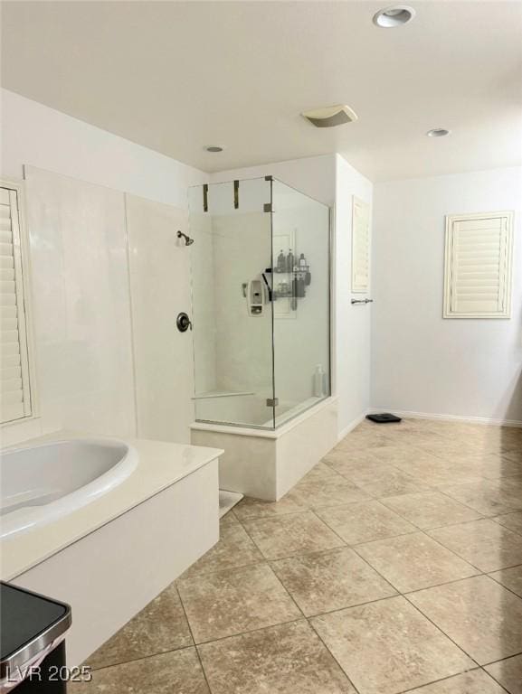 bathroom with tile patterned floors and plus walk in shower